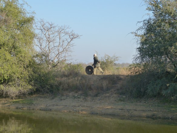 Running to another jeep to make the exchange.