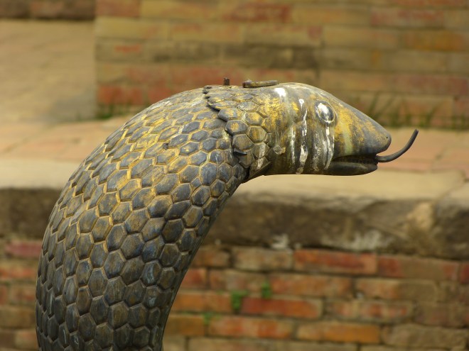 Complete with snake sculptures