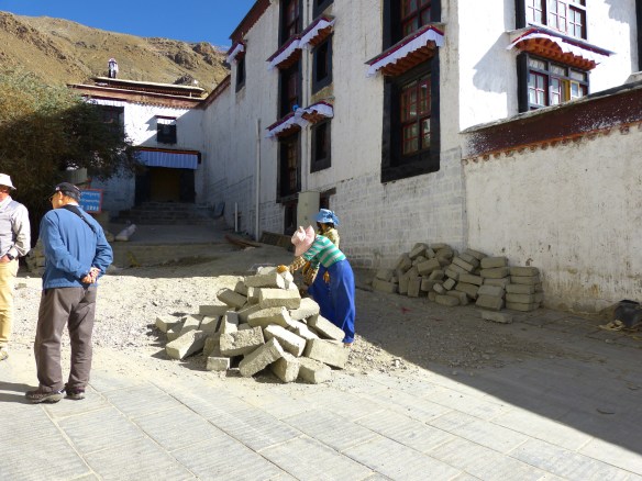 Look who is doing the manual labor